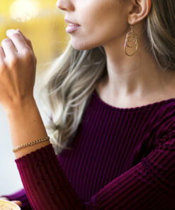 Gold Plated 5mm Gold Cuban Link Bracelet worn by a woman as her bracelet