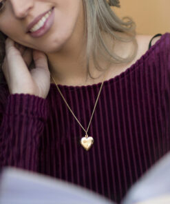 Woman Wearing Gold Plated Heart Locket Necklace, Double Heart Style